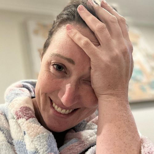 Jana Pittman smiles at the camera with one hand on her forehead as she talks about how hard sleep deprivation is