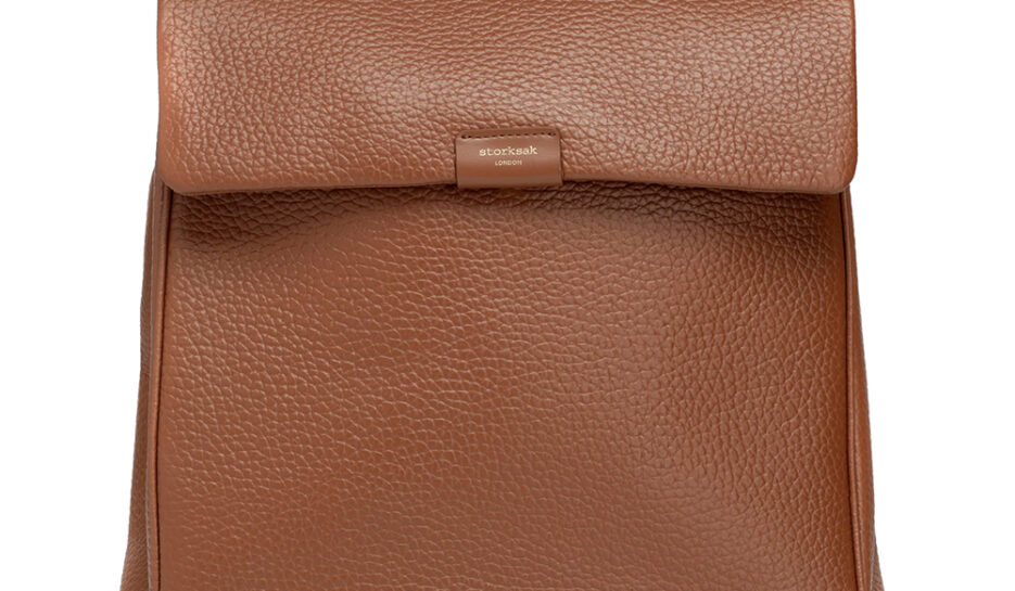 Tan leather backpack style nappy bag can also be used as a shoulder bag