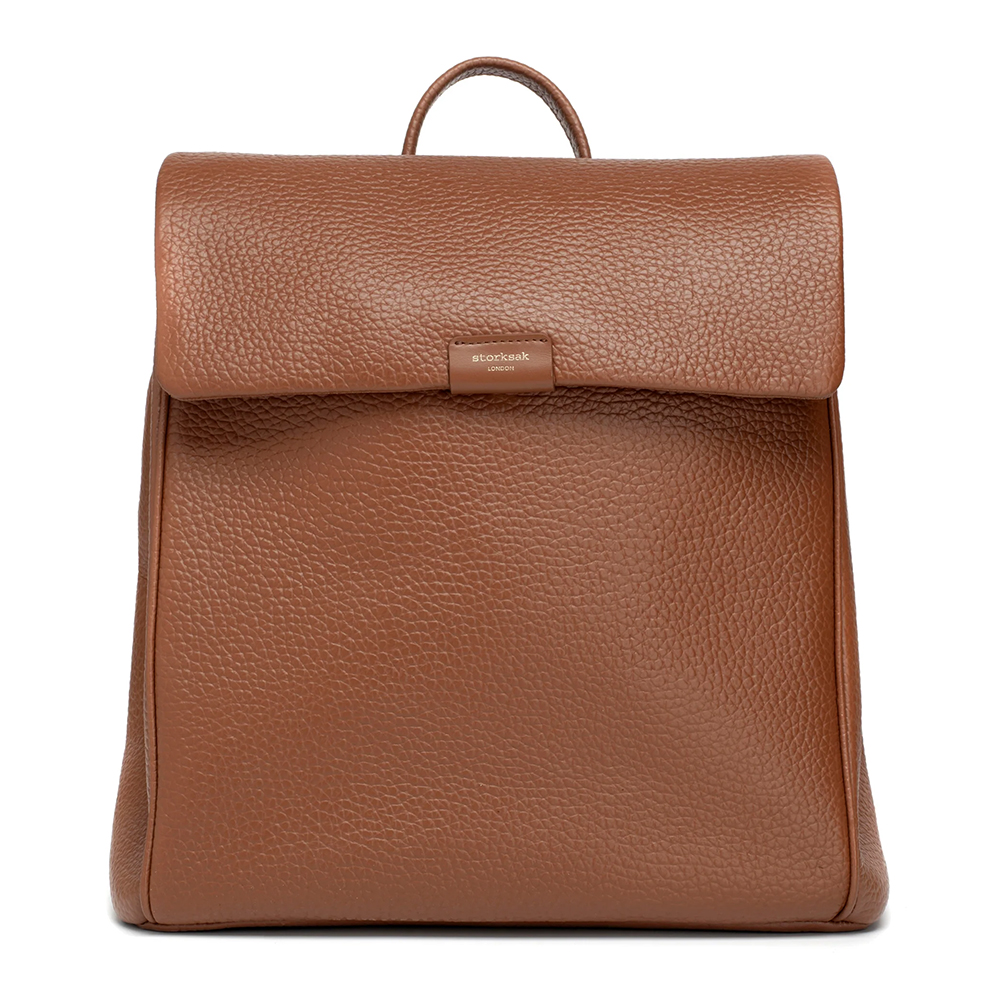 Tan leather backpack style nappy bag can also be used as a shoulder bag