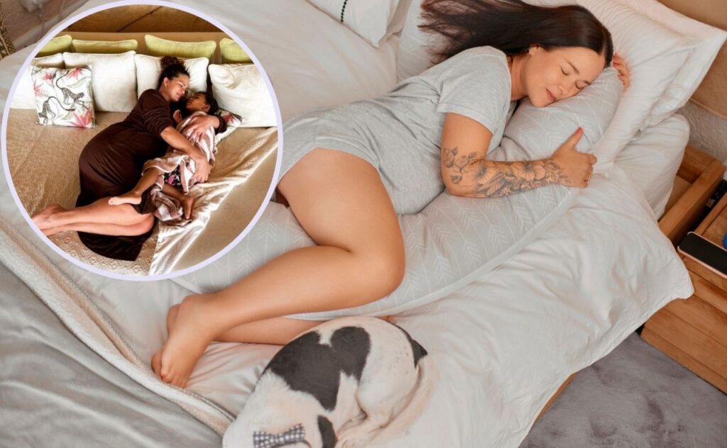 Pregnant woman with long dark hair wearing a grey t-shirt nightie sleeps on her bed, on her side with a pillow and dog at feet, inset pregnant Chrissy Teigen cuddling son