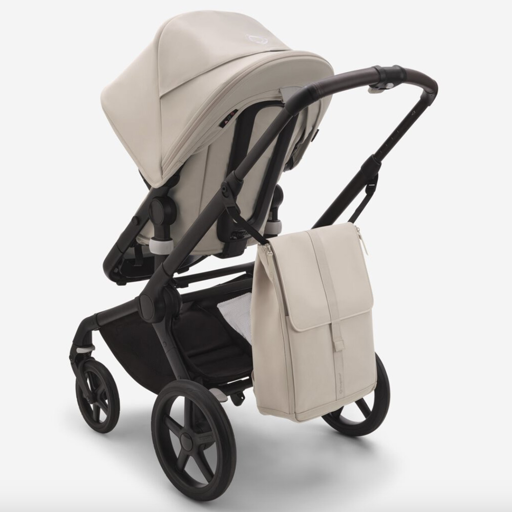 Bugaboo changing backpack in new Taupe colour way handing off the back of a Bugaboo stroller