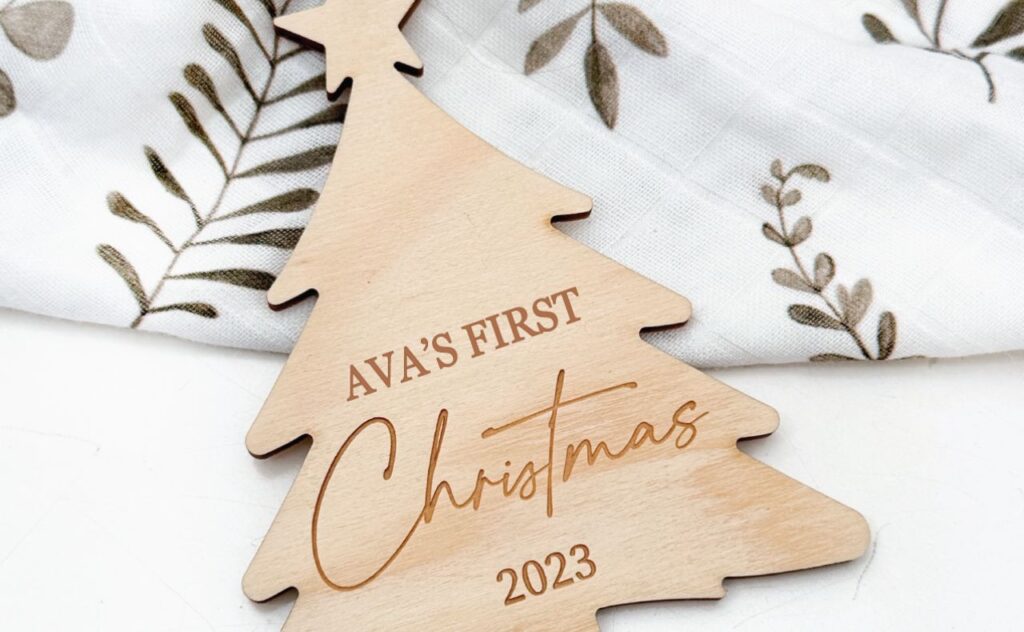 Fir tree shaped ply Christmas decoration with a star at the top and a name on it