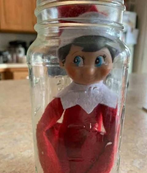 Elf on a shelf stuck in a jar