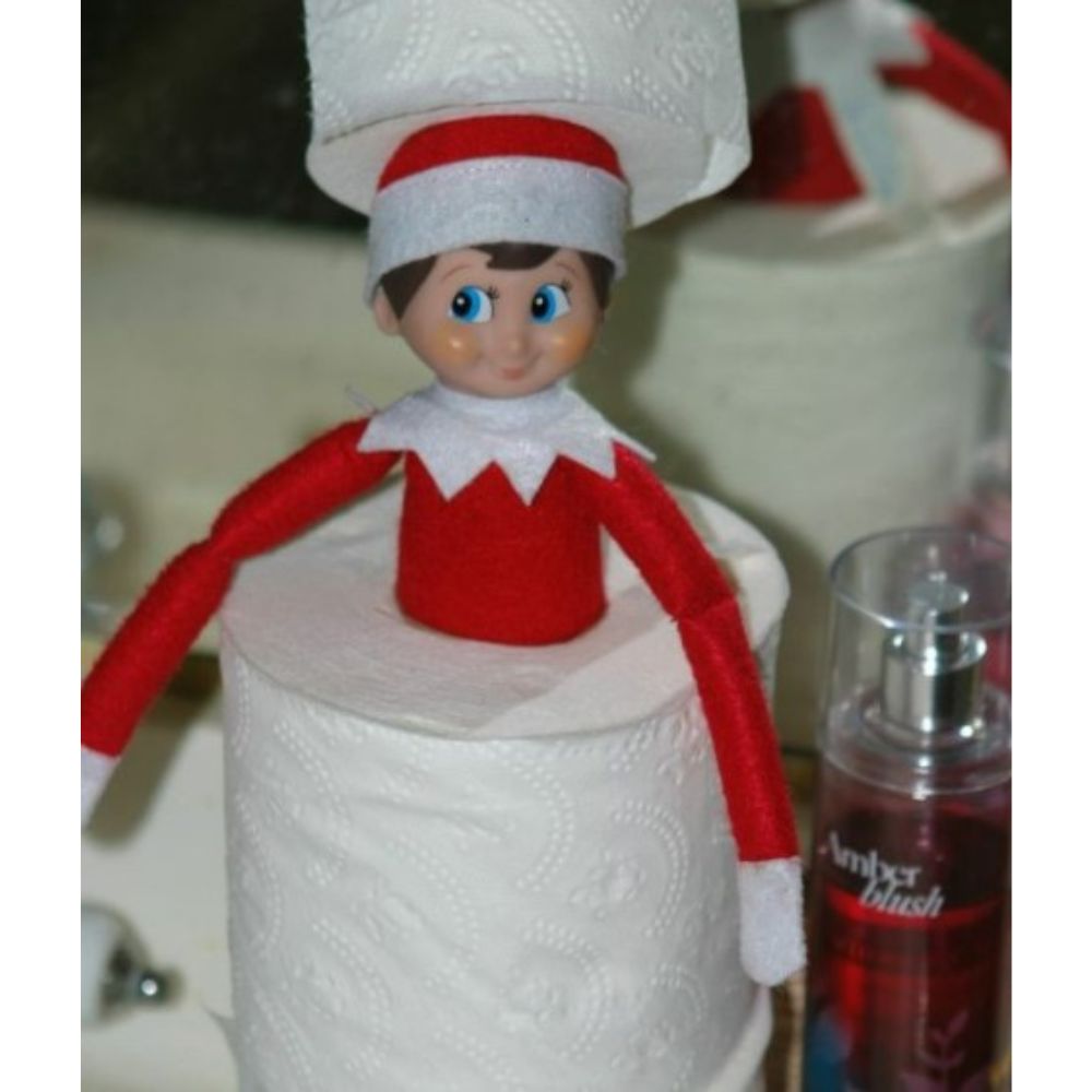 Elf on the shelf hidden in toilet paper