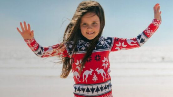 Girl wearing Christmas swim rashie from Ugly Swim Rashie