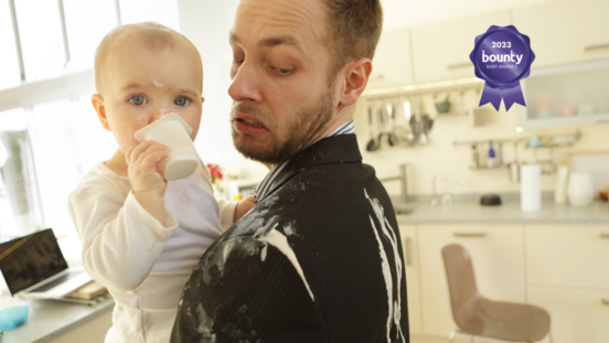 Dad holding baby, both covered in yoghurt