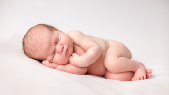 Small, cute newborn baby with perfect skin