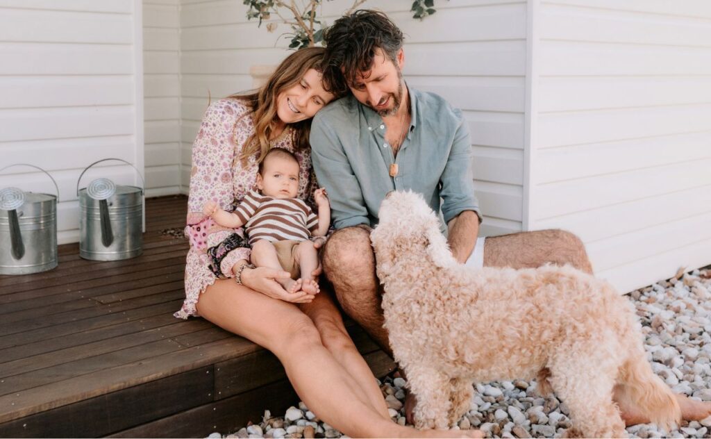 Lisa Messenger with partner, baby  and dog
