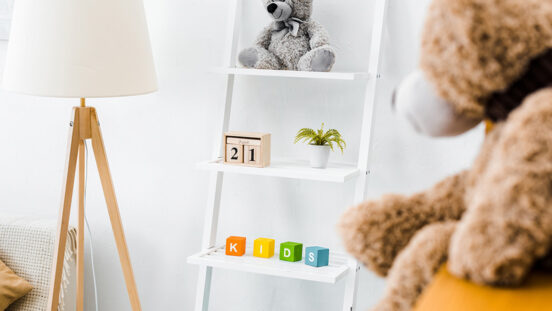 modern interior of nursery room with rack and toys