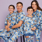 mother, father, daughter and son wearing matching easter family pyjamas