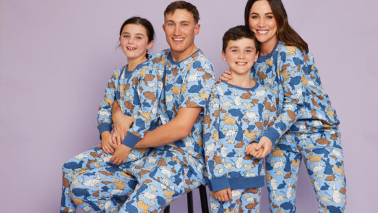 mother, father, daughter and son wearing matching easter family pyjamas