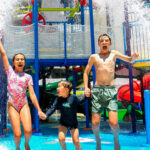 Three young children enjoying the waterpark at Paradise Resort Gold Coast
