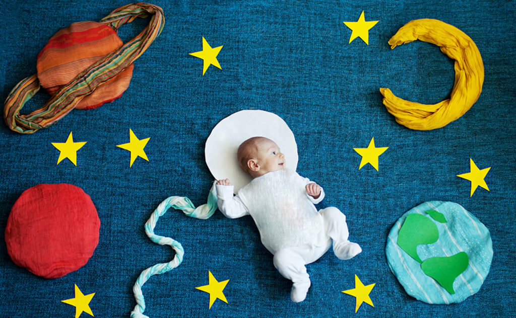 baby photoshoot with astronomy props