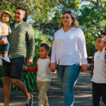 Family walking through the grounds of Auckland zoo