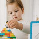 technoference - young girl playing with lego bricks