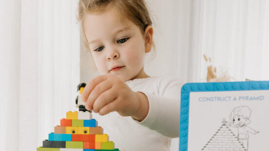 technoference - young girl playing with lego bricks