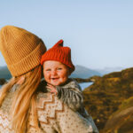Cute baby and mother walking outdoor travel family vacations lifestyle mom and smiling child together Mothers day holiday