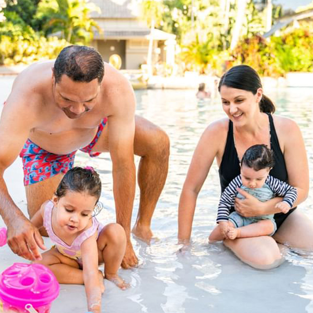 Family of four enjoy Novotel Cairns Oasis Resort pool