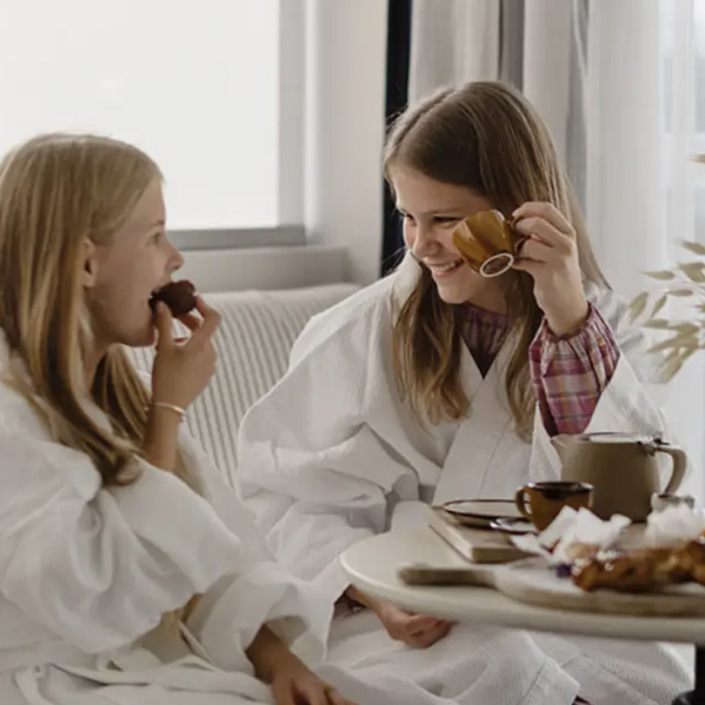 Two young girls enjoy the rooms at Shangri-La The Marina, Cairns
