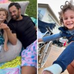 Cam Merchant with son Ollie and broken leg