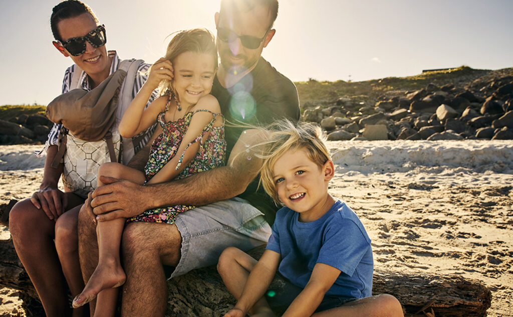 Shot of a happy family having fun at the beach