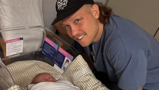 Queensland State of Origin star Reuben Cotter and new baby son in the hospital after birth