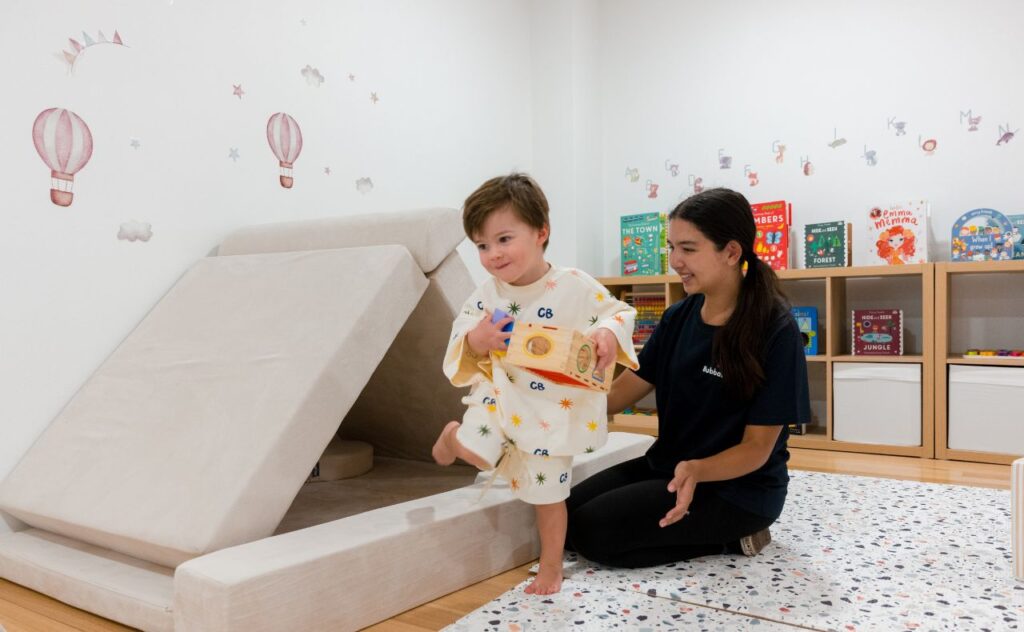 Little boy with childcare Bubba Desk educator