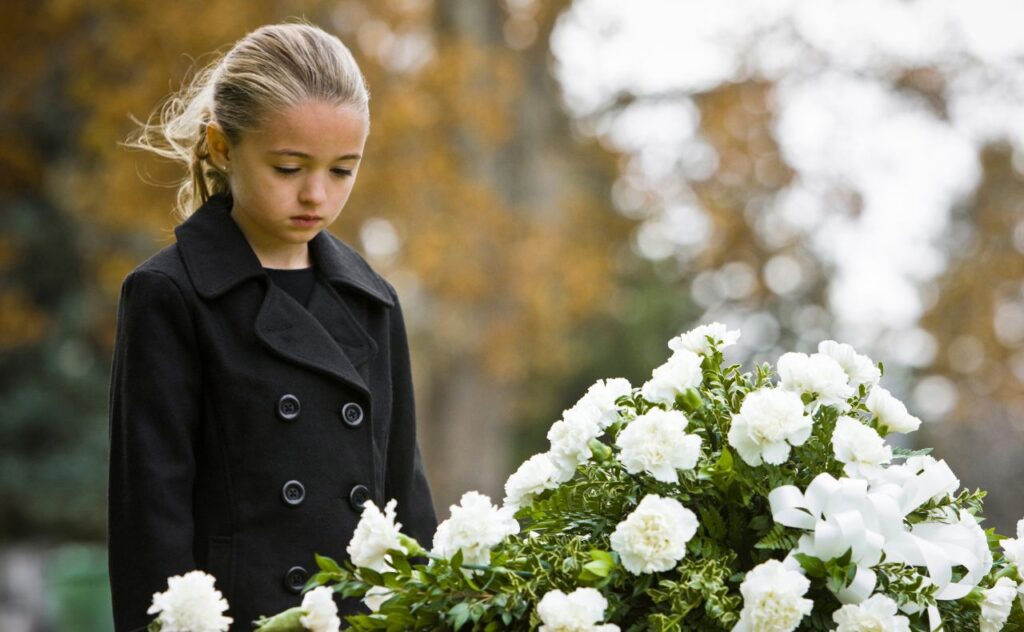 Girl/ child attending a funeral