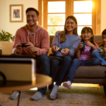 Family of four playing Nintendo Switch together