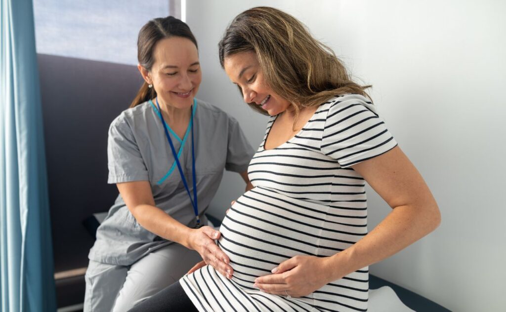 Pregnant woman with doctor for medical check up