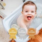 Best baby wash, BBA Awards: Baby in bath sticking tongue out