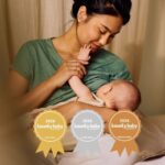 Breast care accessories BBA Awards: mother breastfeeding and smiling at baby