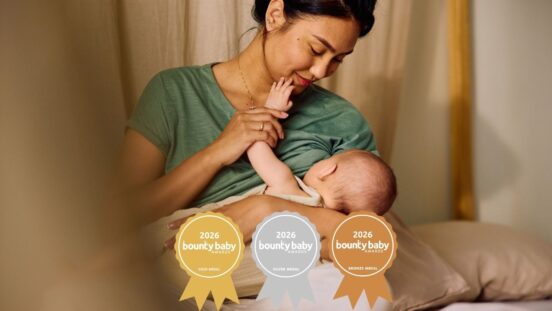 Breast care accessories BBA Awards: mother breastfeeding and smiling at baby