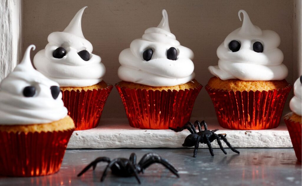 Halloween white chocolate ghost cupcakes with fluffy meringue icing