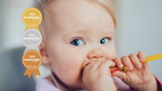 Best high chair: Baby eating food, blue eyes
