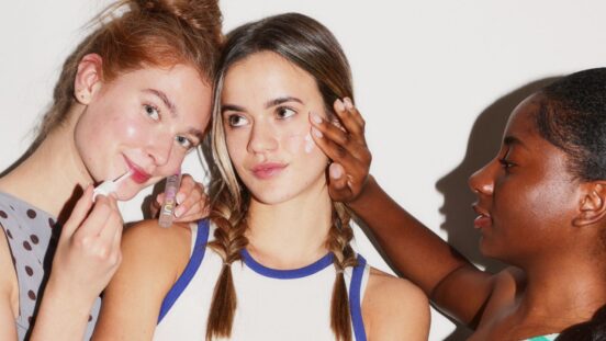 Girls putting on skincare