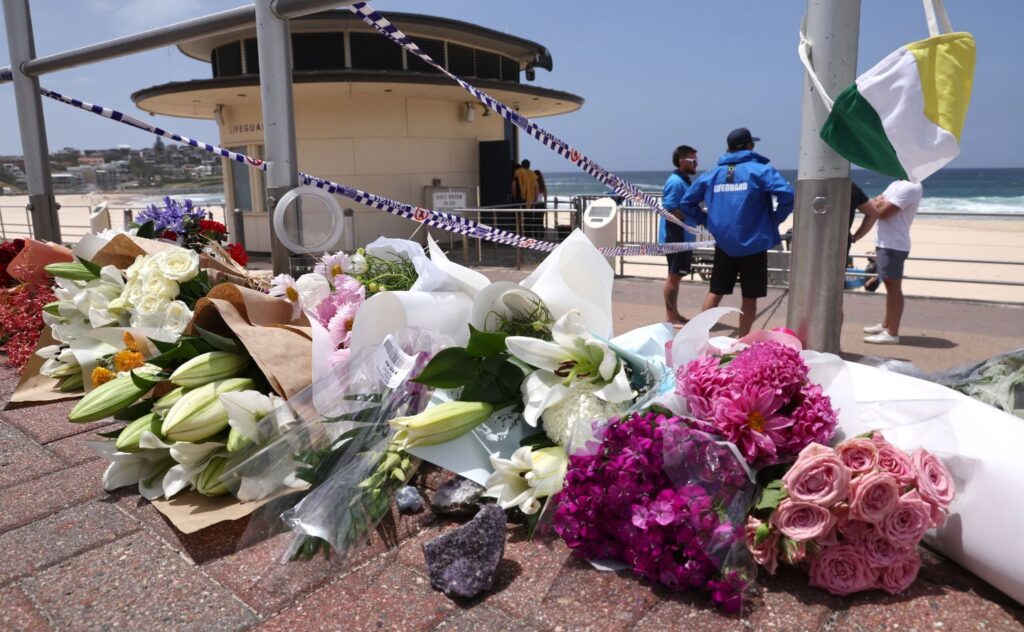 What to say to kids: Flowers are placed outside the lifeguard tower at the Bondi Pavillion in memory of the victims of a shooting at Bondi Beach, in Sydney on December 15, 2025.
