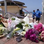 What to say to kids: Flowers are placed outside the lifeguard tower at the Bondi Pavillion in memory of the victims of a shooting at Bondi Beach, in Sydney on December 15, 2025.