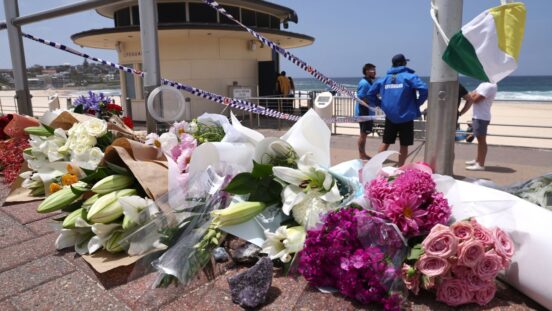 What to say to kids: Flowers are placed outside the lifeguard tower at the Bondi Pavillion in memory of the victims of a shooting at Bondi Beach, in Sydney on December 15, 2025.