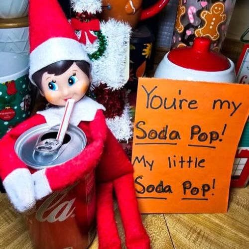 Elf on the shelf: Kpop demon hunters with You're my soda pop, my little soda pop sign