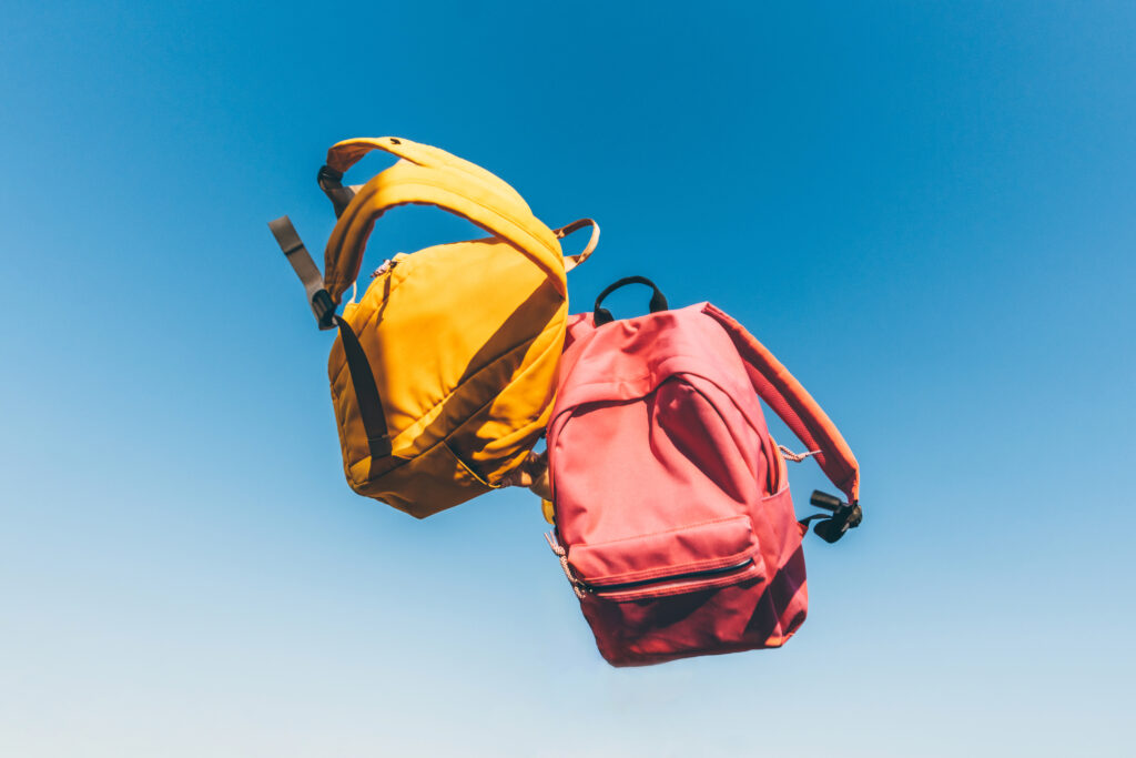 school backpacks flying