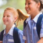 two school girls smiling