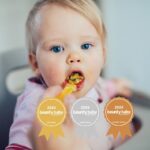 Best Feeding Device for Solids Toddler girl in high chair eating