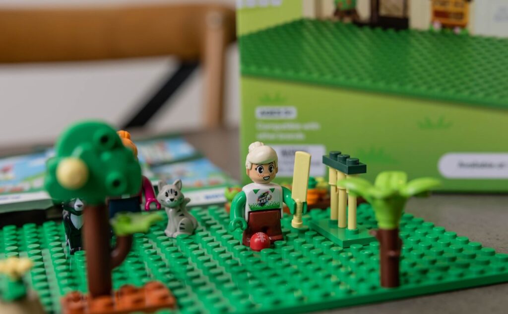 collecting 40 Bricks of common items people find at home and in their pantry, as well as pets and different family member characters, including a Woolworths Cricket Blast girl, Laura.