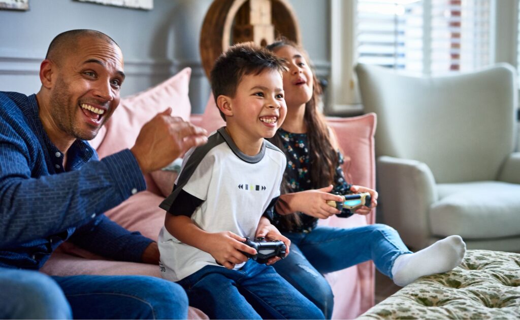 Internet safety: Boy and father gaming together