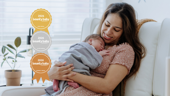 Best nursery accessory: Mother cuddling newborn in nursery