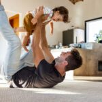 Best washable rugs: Father and toddler son playing on rug.