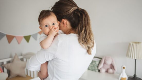 Mother with baby in nursery: Parenting and baby products