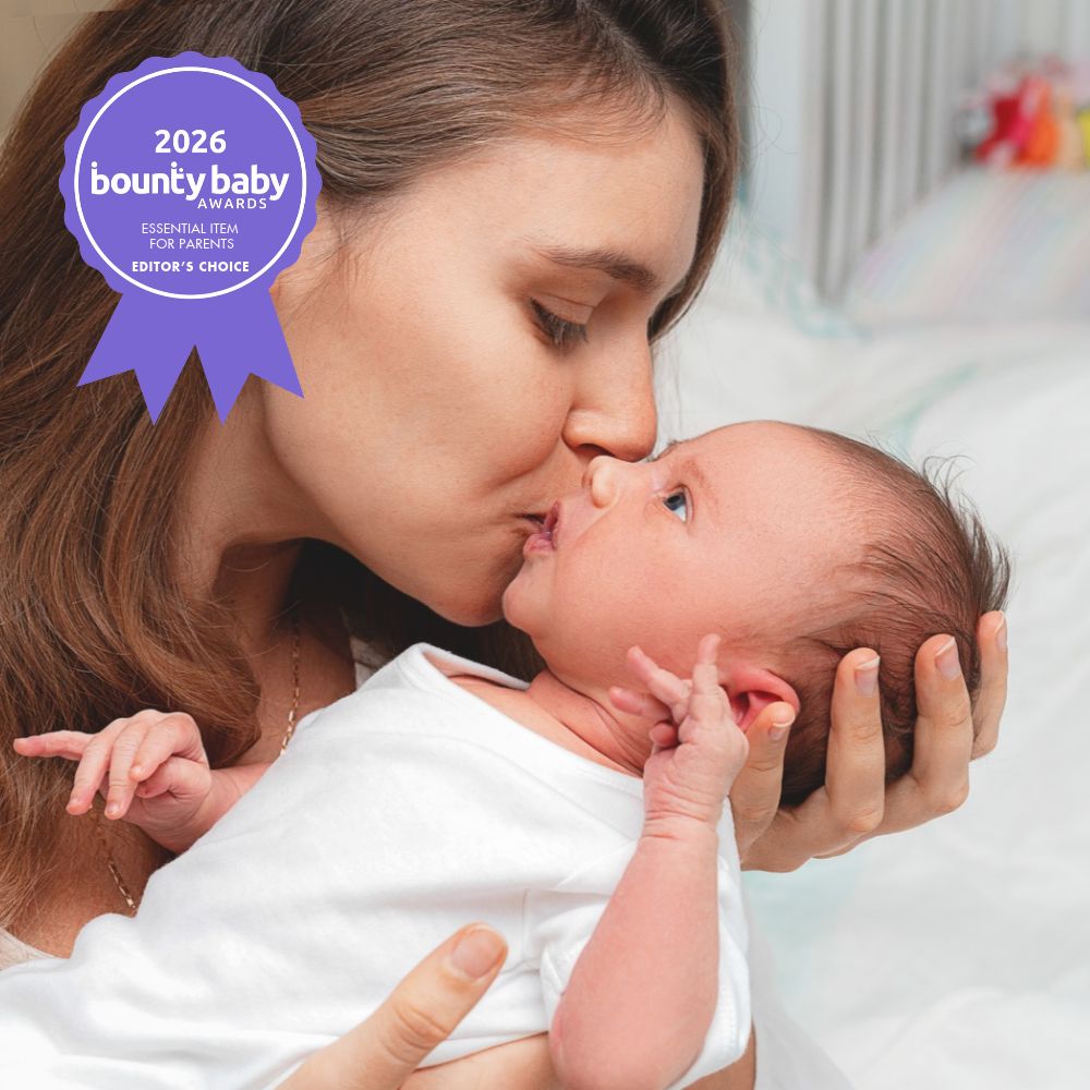 Editors' Choice - Essential Items for parents - mother kissing newborn