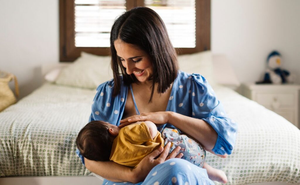 Feeding: Mother breastfeeding baby